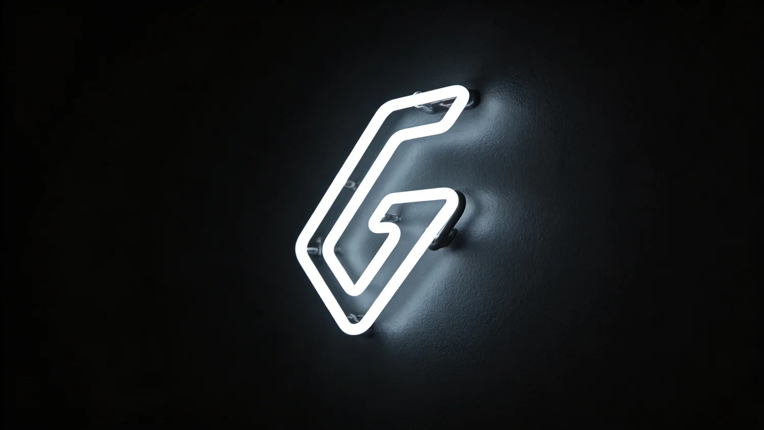 The illuminated Guild mark on the academy wall